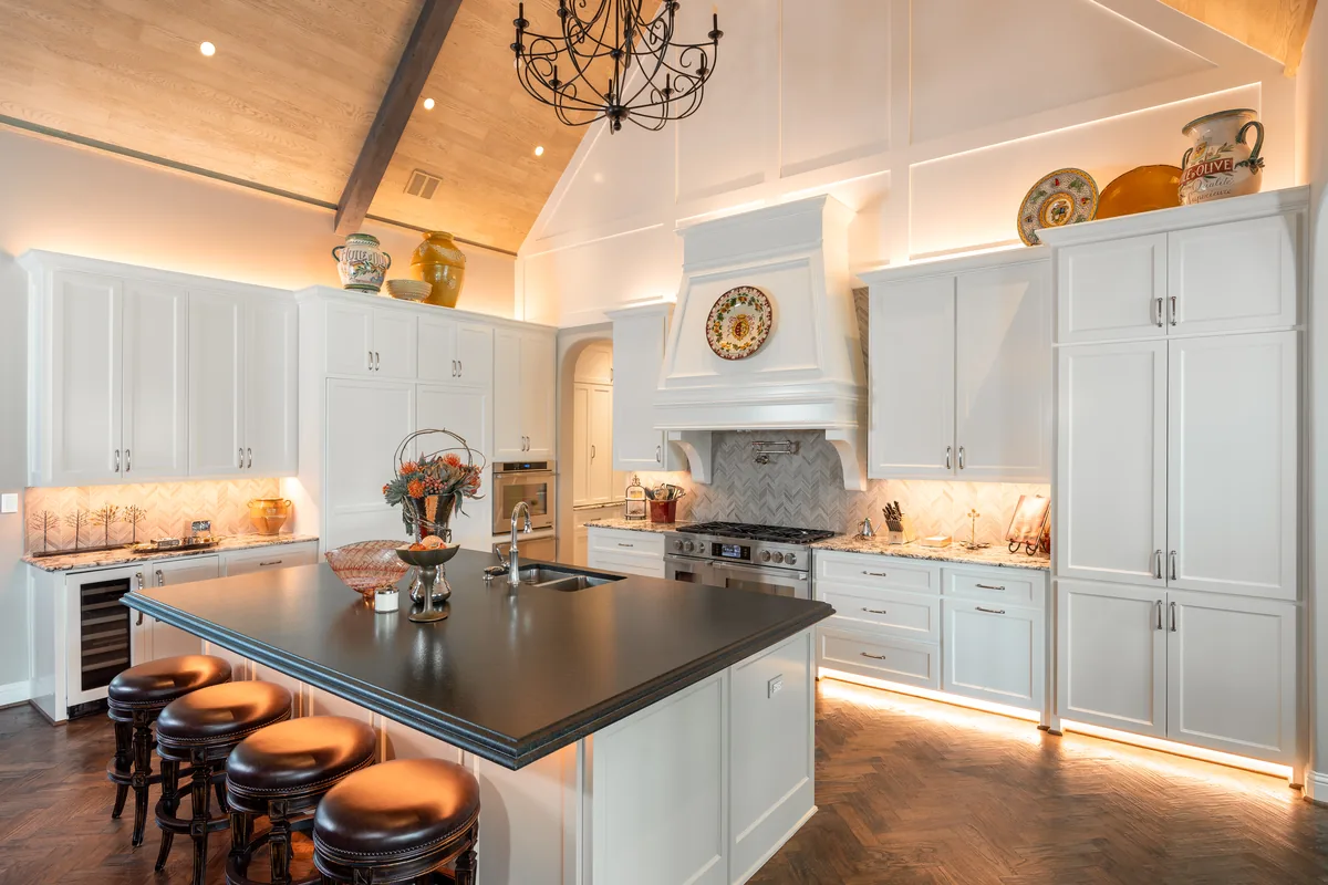 Kitchen after: under-cabinet, in-cabinet and cove lighting around the island
